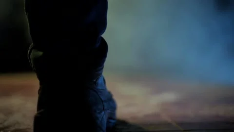 Dark gothic scene of a man running taken from a low angle in dramatic light. Stock Footage 195072570
