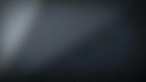 Dark gradient blur background with black gray and charcoal colors in 4K res.. Stock Photos