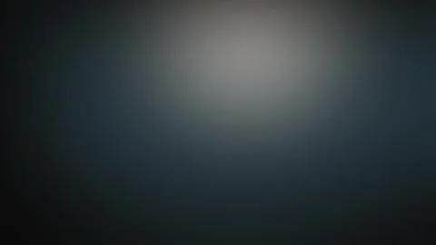 Dark gradient with soft light center, creating a moody ambiance. Seamless loop Stock Footage 300840382