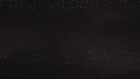Dark grainy film texture with subtle static and light specks	 Stock Footage 291892403