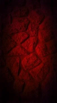 Dark grainy stone wall with a dramatic red glow at the center, creating a b.. Stock Photos