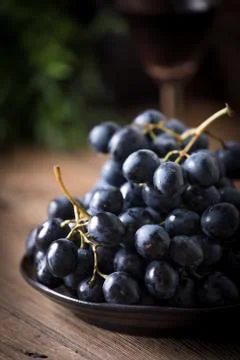 Dark grape in bowl. Stock Photos