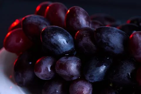 Dark grapes close-up for rustic fruit food background Stock Photos