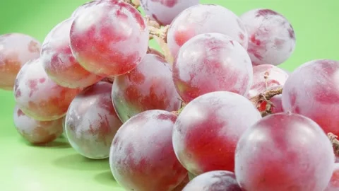 Dark grapes on a green background close-up. Ripe berries. Macro. Stock Footage 140473618
