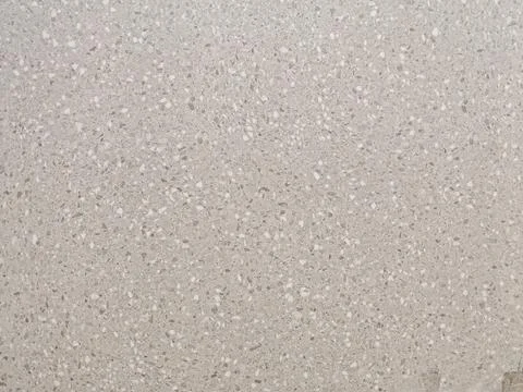 Dark graphite speckled stone texture or composite quartz Fotos Stock