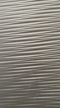 Dark gray abstract background, wavy pattern. Texture. Close-up. Stock Photos