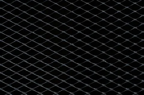Dark gray and silver grid of metal fence that taking as background.. Stock Photos