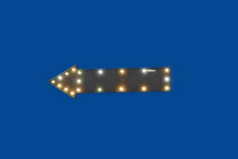 Dark gray arrow with light bulbs on a blue background, pointer, horizontal Stock Photos