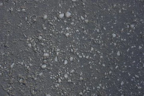 The dark gray asphalt texture background rocks dirt sand Stock-Fotos