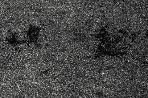 Dark gray asphalt texture with small stones Stock Photos
