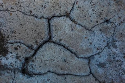 Dark gray background with cracks and hollows Stock Photos