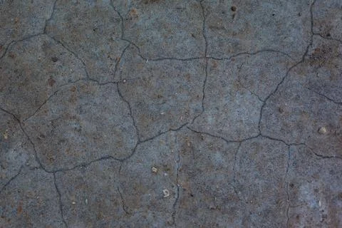 Dark gray background with cracks and hollows Stock Photos