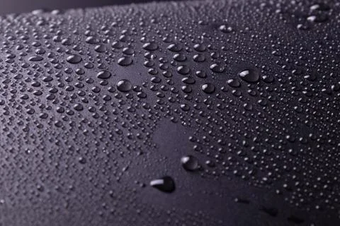 On a dark gray background in a studio with white lighting and unevenly spraye Stock Photos