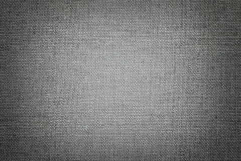 Dark gray background from a textile material with wicker pattern, closeup. Stock Photos