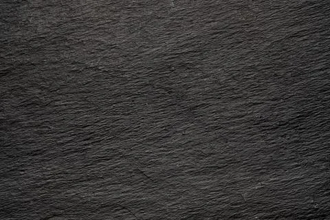 Dark gray black slate background or natural stone texture. Black board for se Stock Photos