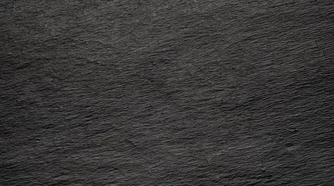 Dark gray black slate background or natural stone texture. Black board for se Stock Photos