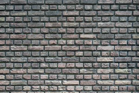 Dark gray brick wall background Stock Photos