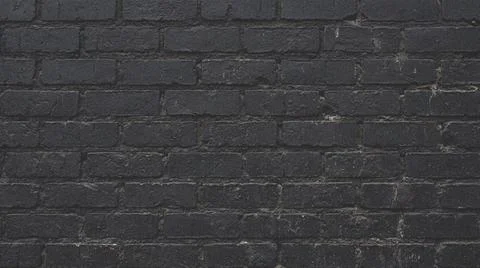 Dark gray brick wall background texture. Fotos Stock