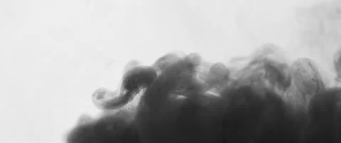 Dark gray cloud of paint billows in water Stock Footage 136494605