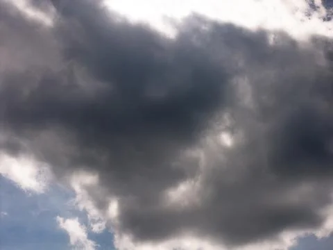 Dark Gray Cloud Underside With Bright Backlit Edges Stock Photos