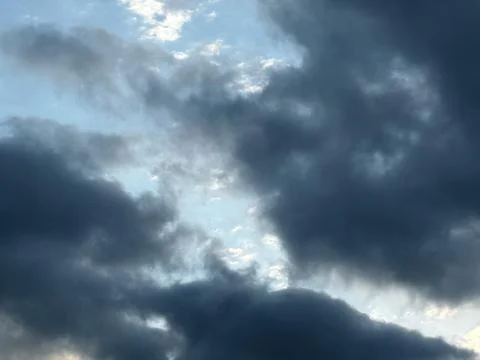 Dark Gray Clouds Framing Bright Sky Stock Photos