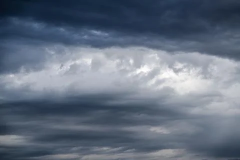 Dark gray dramatic sky with large clouds Stock Photos