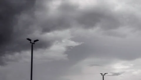 Dark gray dramatic sky with large clouds before rain. Stock Photos