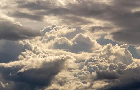 The Dark gray dramatic sky with large clouds in evening. Stock Photos
