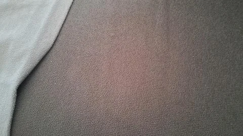 Dark gray fabric texture with a soft light blue edge border Stockfoto's