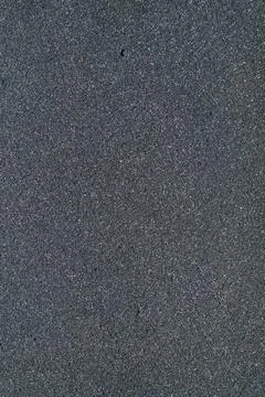 Dark gray foam structure with small holes Stock Photos