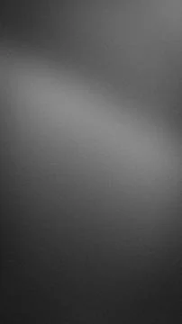 Dark gray gradient grainy textured vertical background with soft blurred ef.. Stock Photos