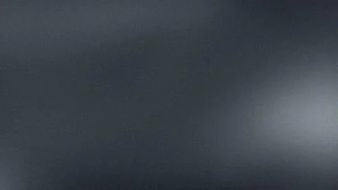 Dark gray gradient texture with grainy effect and subtle light blur suitabl.. Stock Photos