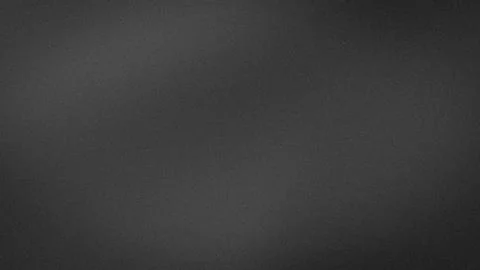 Dark gray grainy abstract background 4K texture smooth gradient grunge wall.. Stock Photos