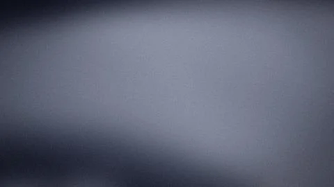 Dark gray grainy textured digital background with gradient blur for 4K tech.. Stock Photos