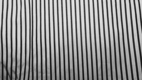 Dark gray heather cotton fabric texture creates a minimalist abstract background Stock Footage 339106351