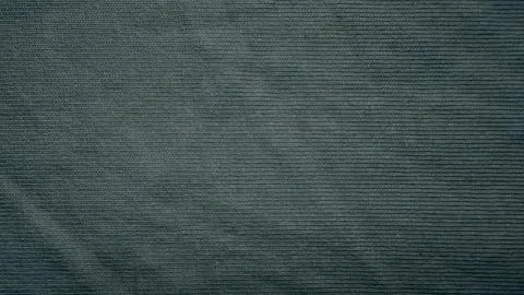 Dark gray knitted fabric texture showcases detailed fine wool ribbed pattern  写真素材