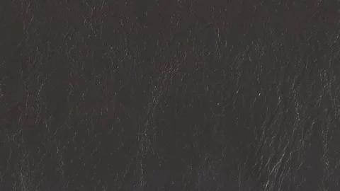 Dark gray leather texture with wrinkles, grain and wear depicted horizontally Stock-Footage 335662336