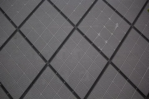 Dark gray mesh grid pattern with diamond shaped geometric segments, geometric Stock Photos