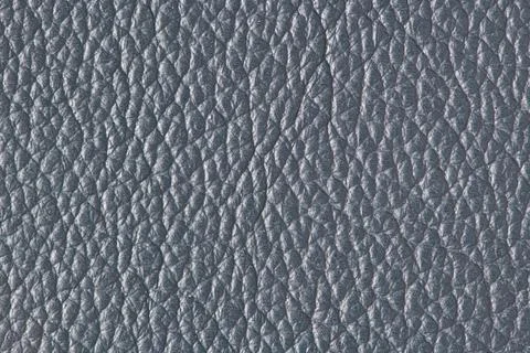 Dark gray pebble leather texture background Stock Photos