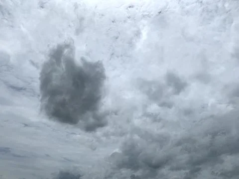 Dark gray rain clouds floated in the sky Photos