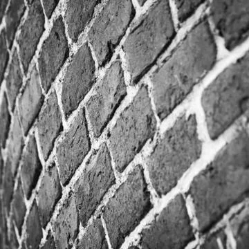 Dark gray round brick wall pattern Stock Photos