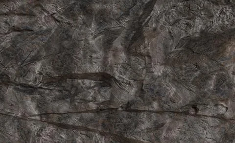 Dark gray stone surface with intricate patterns and textures 스톡 사진