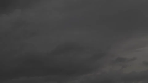 Dark gray storm clouds gathering across the sky during a gloomy overcast Video stock 341563038