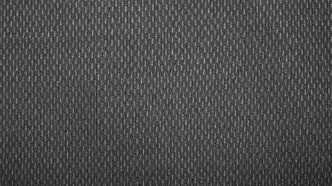 Dark gray texture with a speckled effect.The background is grey with white speck Stock Photos