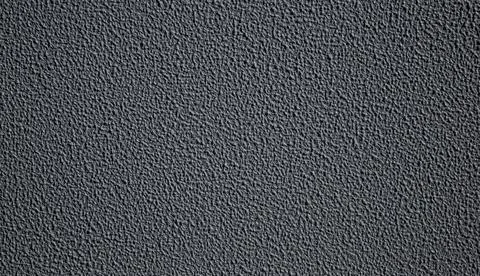 Dark gray textured background creating repeating pattern Stock Photos
