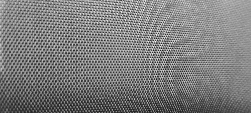 Dark gray textured background with a subtle matte finish and organic surfac.. 写真素材