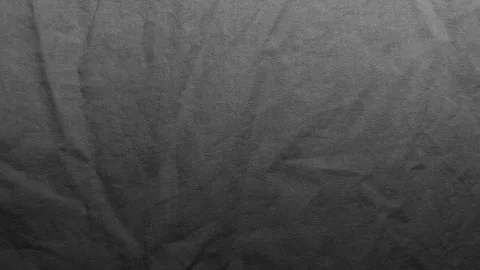 Dark gray textured fabric background shows soft creases on fine woven linen mate Stock Footage 339106337