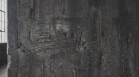 Dark gray textured wall with window. Fotos Stock
