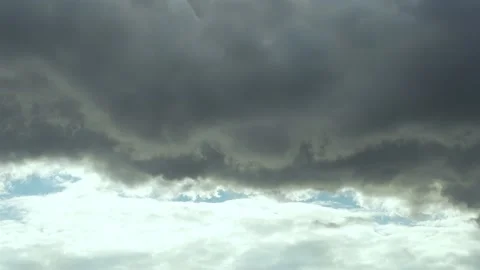 Dark Gray Thunderclouds Hanging Over White Cumulus Clouds in Thunderstorm, Beaut Stock Footage 220549147