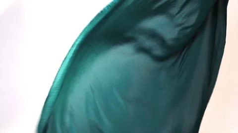 Dark green blue fabric flows on an air Stock Footage 64534607